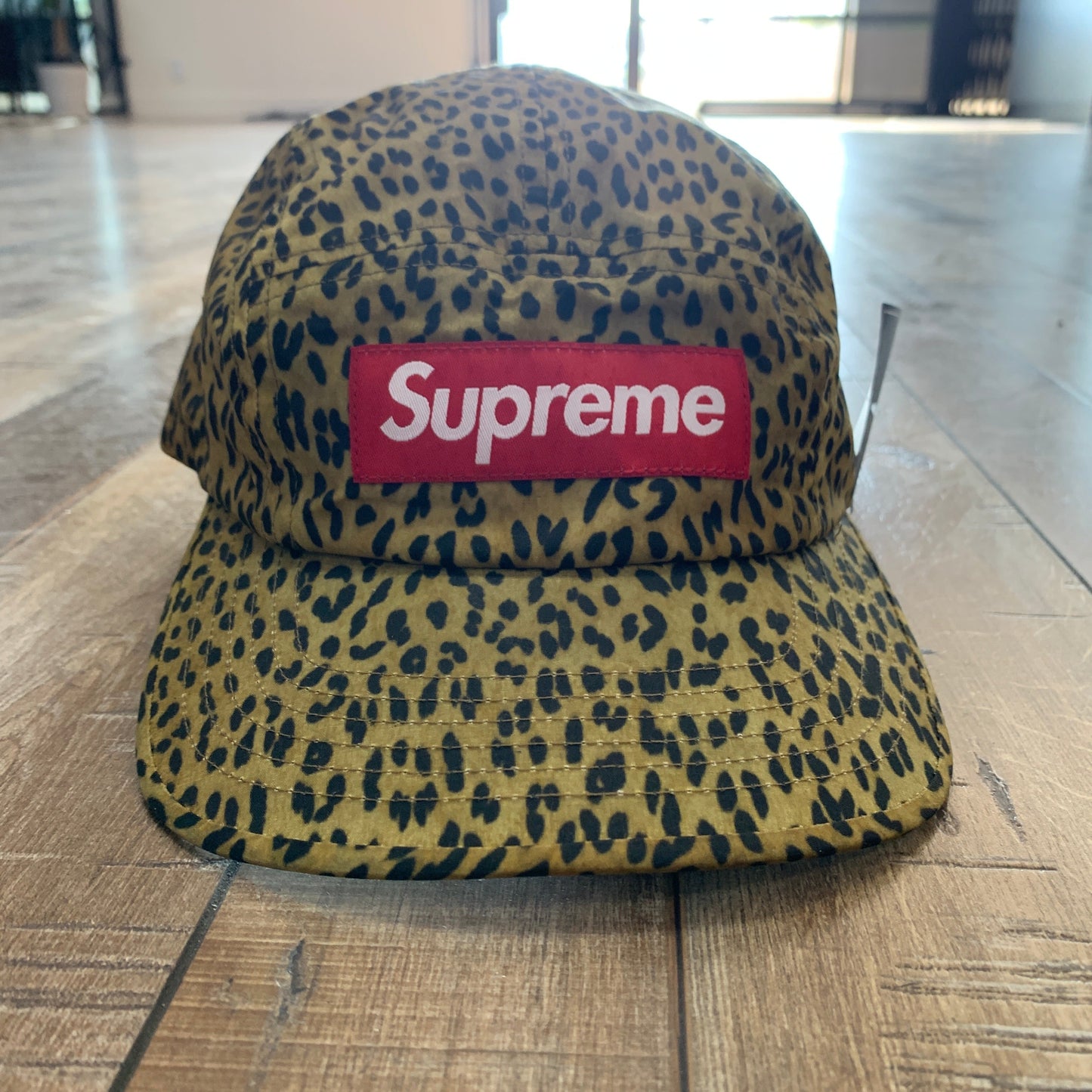 Supreme Barbour waxed cotton camp cap with leopard print design.