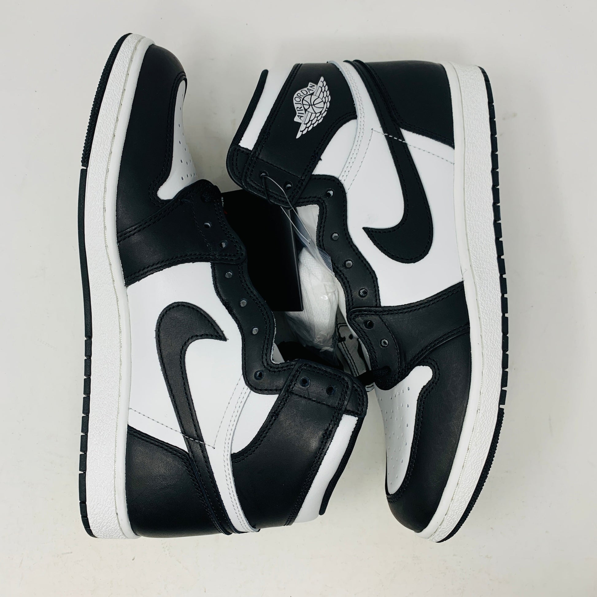 Jordan 1 Retro High 85 Black White 2023 sneakers, shown brand new with extra white laces.