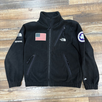 North Face Trans Antarctica Expedition Fleece Jacket Black, preowned, featuring American flag and branded patches.