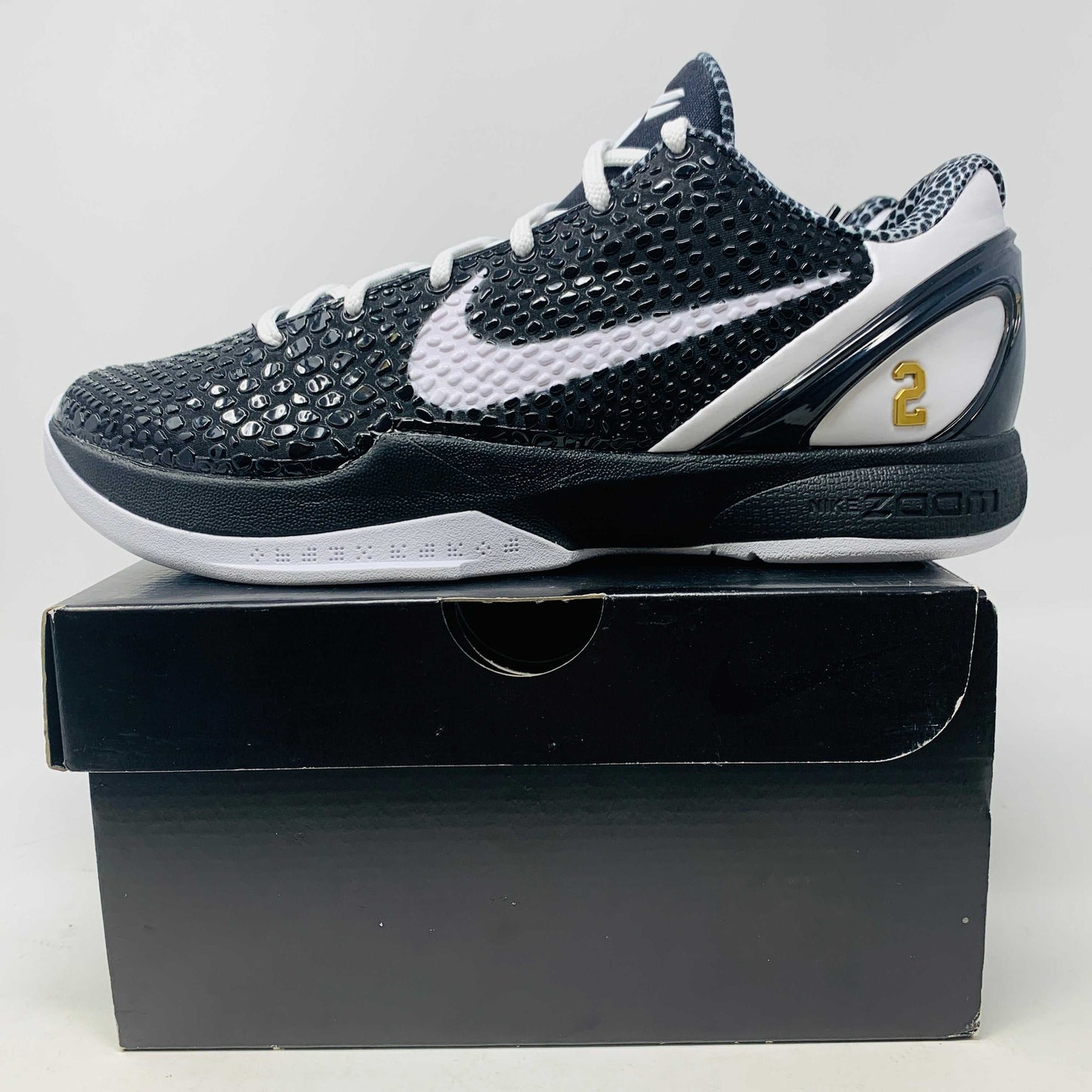 Kobe 6 Mambacita basketball shoes in black and gold.