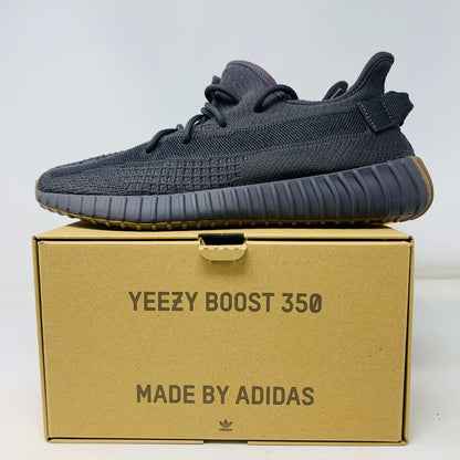 Yeezy 350 Cinder sneaker on box, neutral grey and black colorway.