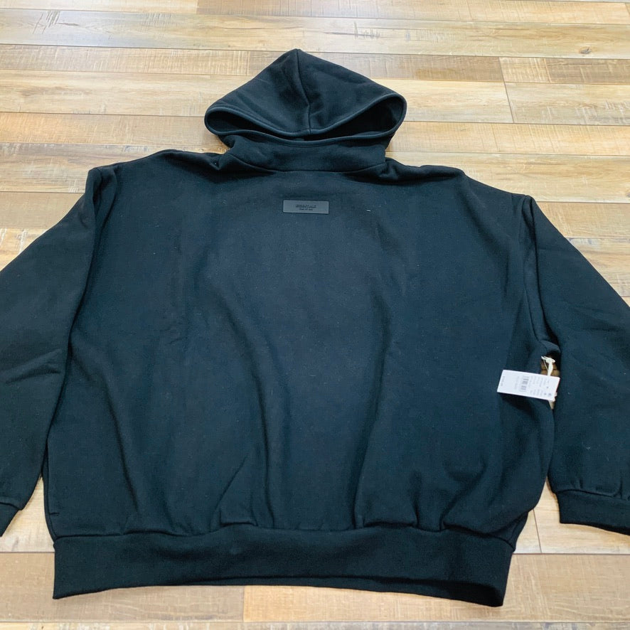 Fear of God Essentials Jet Black Hoodie with Chest Logo.