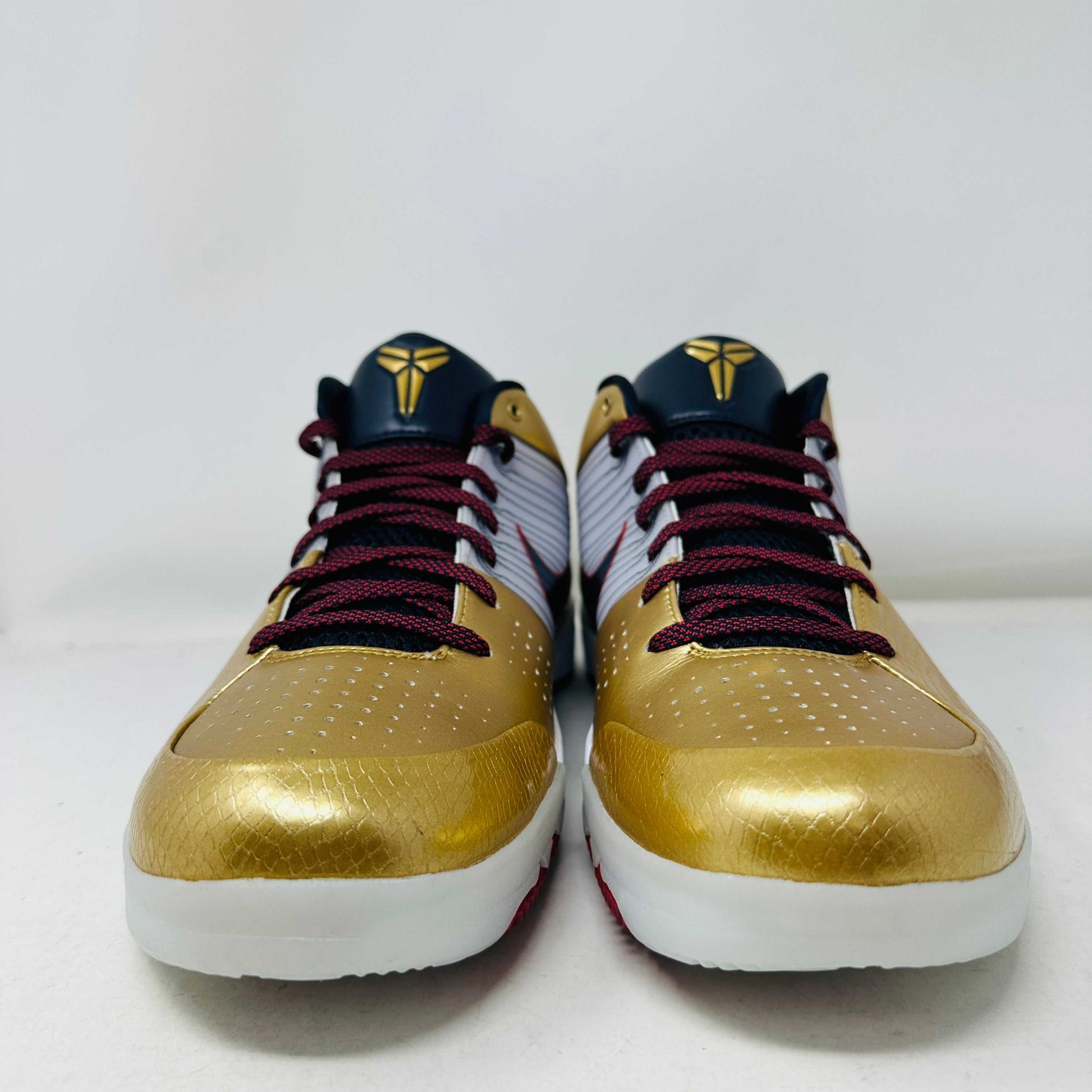 Nike Kobe 4 Protro Gold Medal (2024) basketball shoes in gold and black colorway.