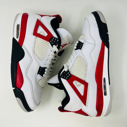 The Jordan 4 Retro Red Cement sneakers, by Jordan, are showcased on their box. They feature authentic white leather, clean uppers with red accents, black netting, and visible air cushioning. The textured box includes a size label.