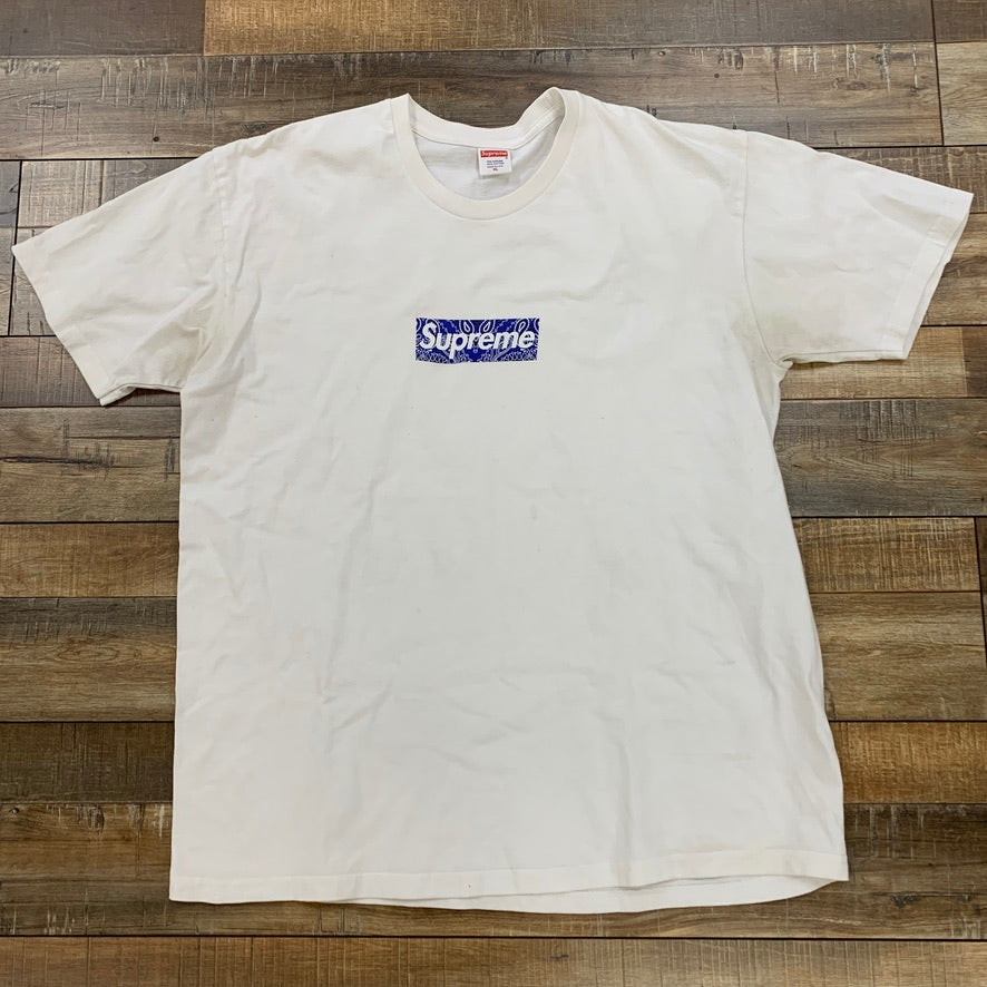 Supreme Bandana Box Logo Tee White on wooden floor background, preowned condition.