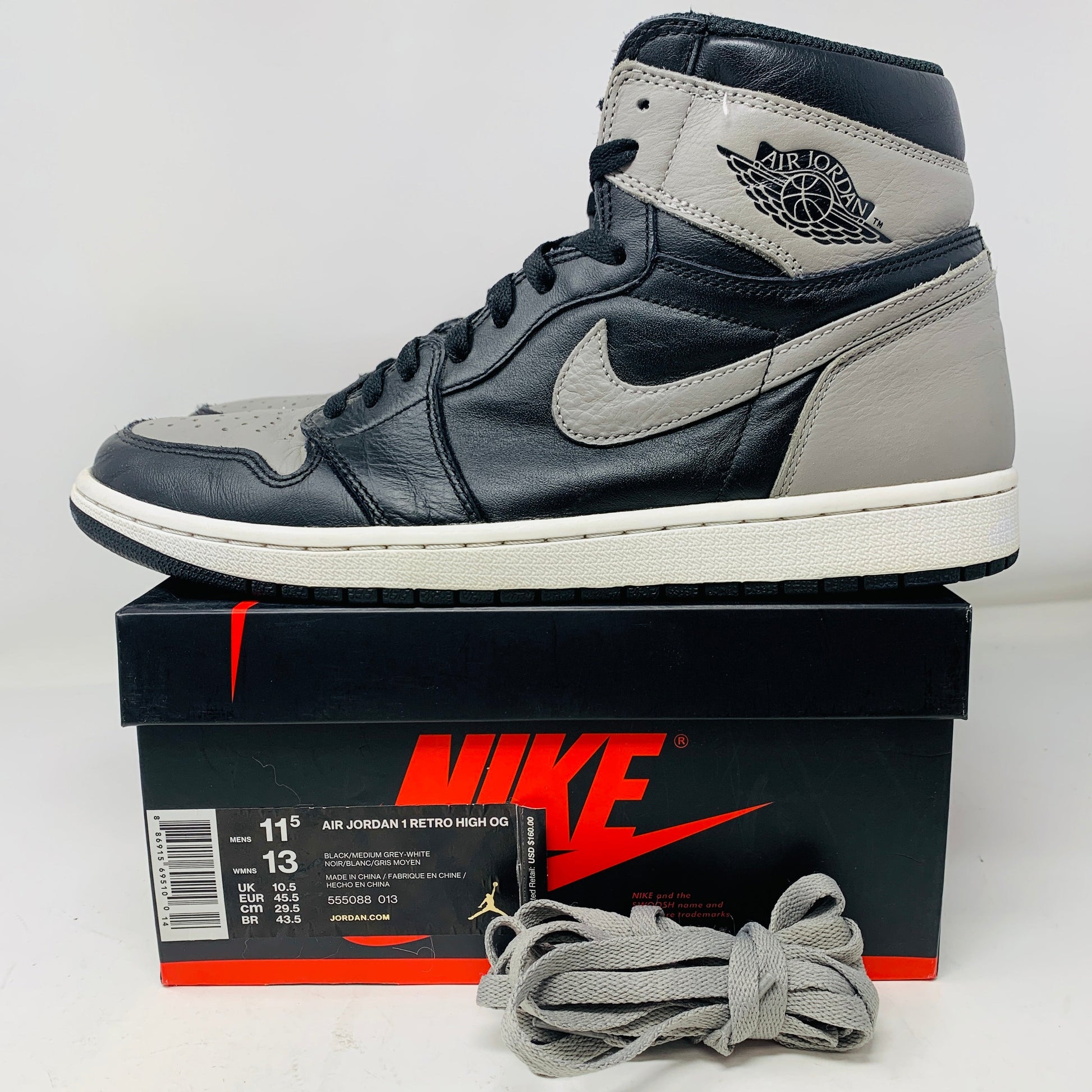 Jordan 1 Retro High Shadow 2018 sneakers, size 11.5, black and gray, on original Nike box with extra laces.