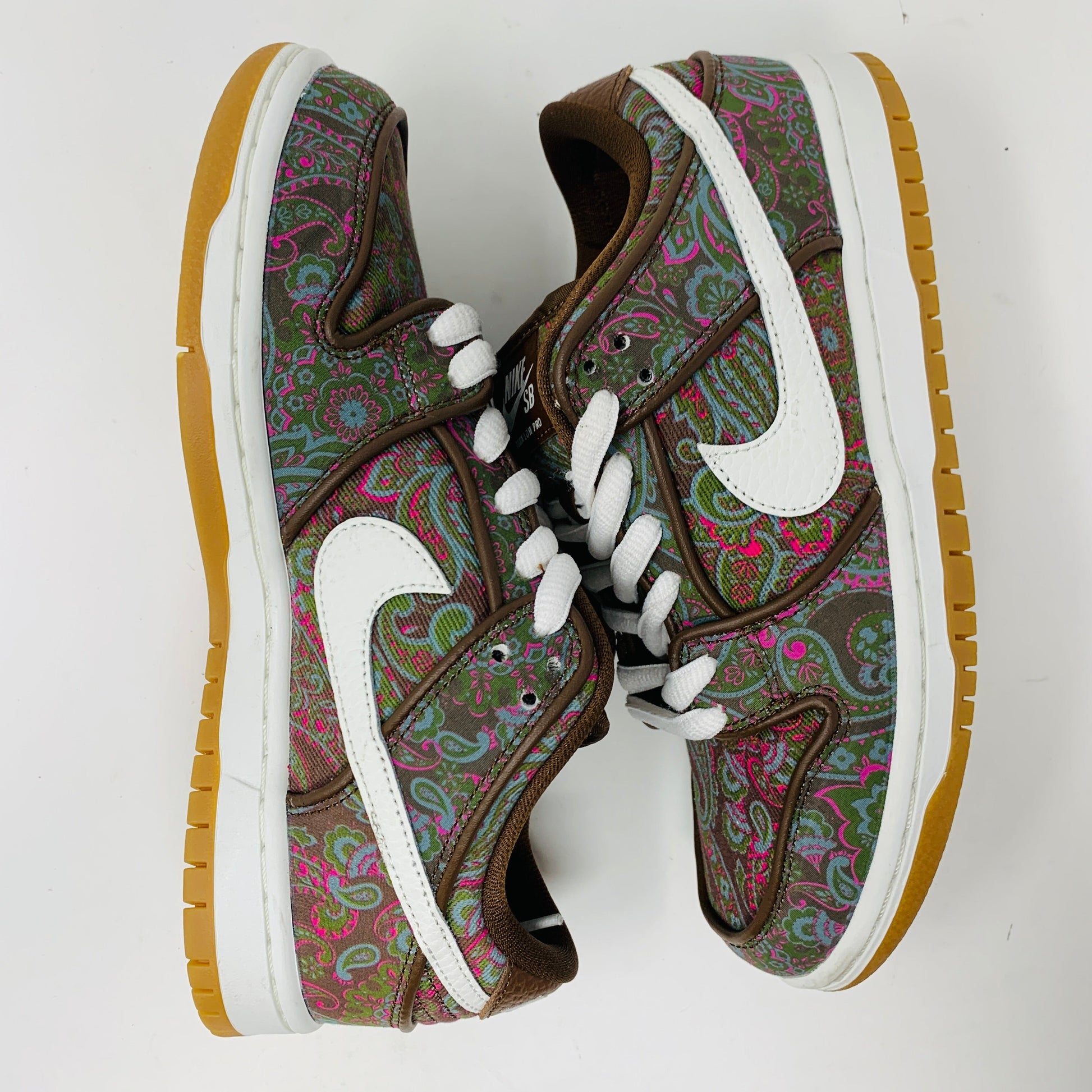 Nike SB Dunk Low Pro Paisley Brown sneakers with brown paisley pattern, suede and leather materials, and white detailing.