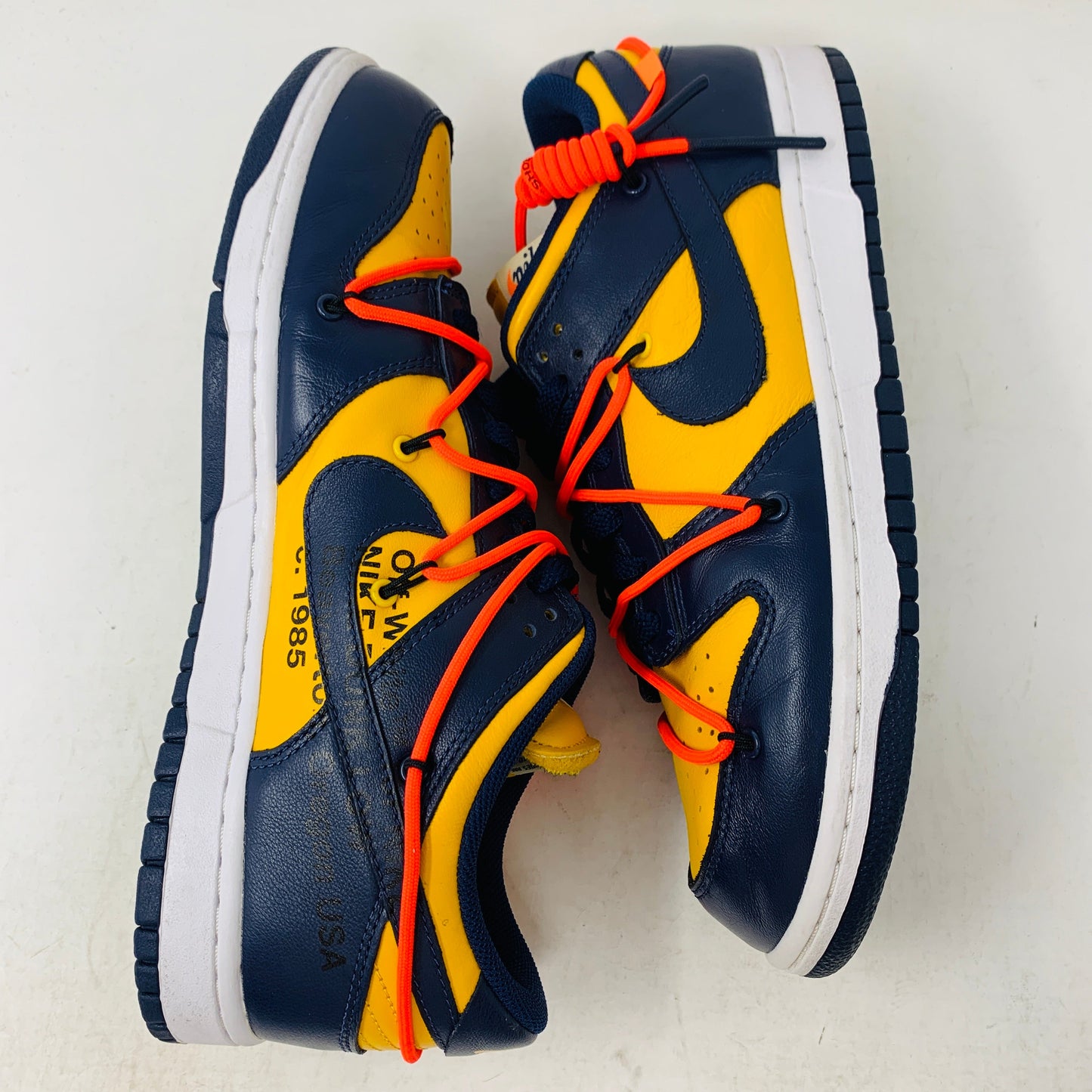 Nike Dunk Low Off-White University Gold sneakers with vibrant yellow and navy design.