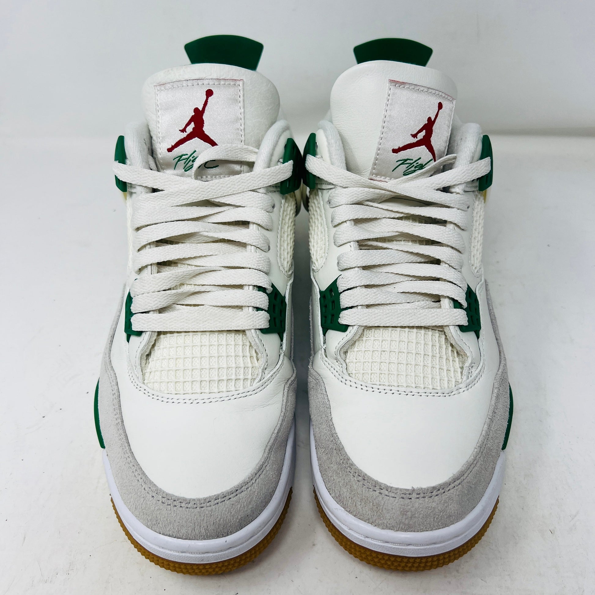 Jordan 4 Retro SB Pine Green sneakers, size 9, 2023, used condition 8.25/10, with visible wear on uppers and durable soles.