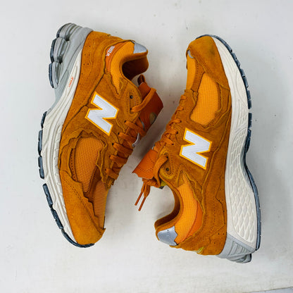 New Balance 2002R Protection Pack Vintage Orange sneakers, size 9.5M, lightly used.