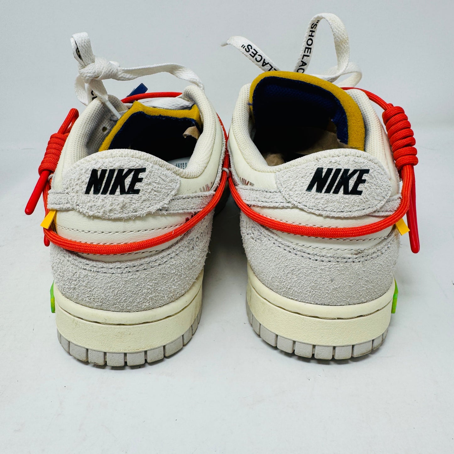 Nike Dunk Low Off-White Lot 13 sneakers, rear view showing design details and branding.