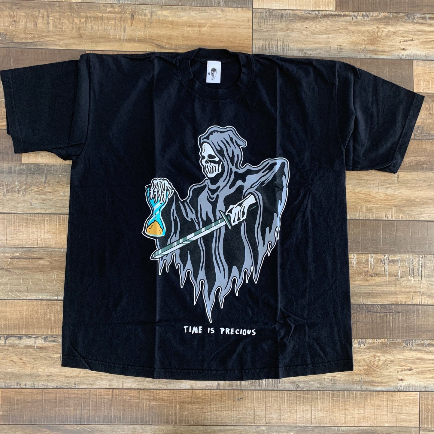 Warren Lotas Time Is Precious Reaper Tee, black with grim reaper graphic and "Time Is Precious" text.