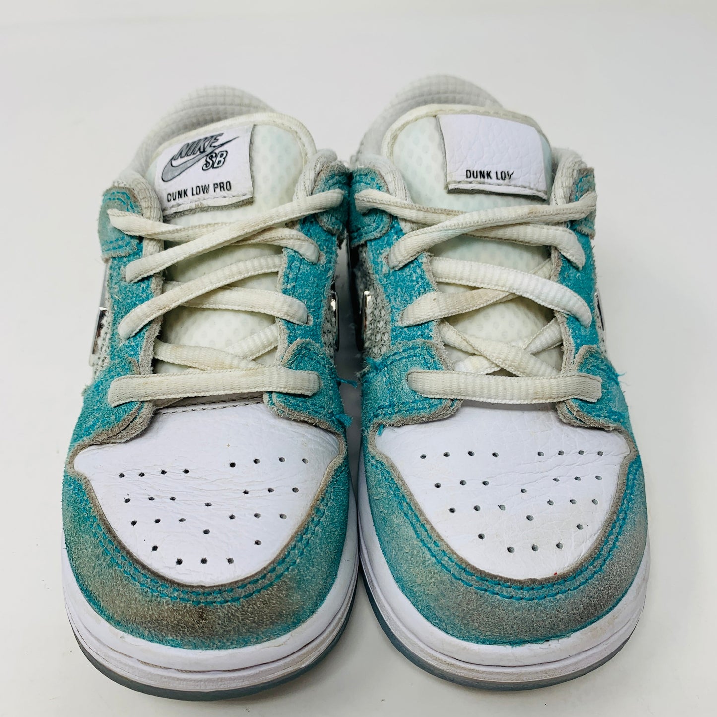 Nike SB Dunk Low April Skateboards TD sneakers with worn uppers and outsoles, no box.