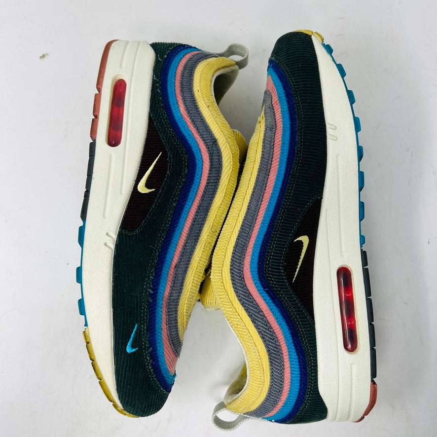 The Nike Air Max 1/97 Sean Wotherspoon sneakers feature a layered design in yellow, blue, pink, and gray with a wave logo on the tongue. These authentic shoes have a textured upper stitched intricately for an eye-catching finish against a white background.