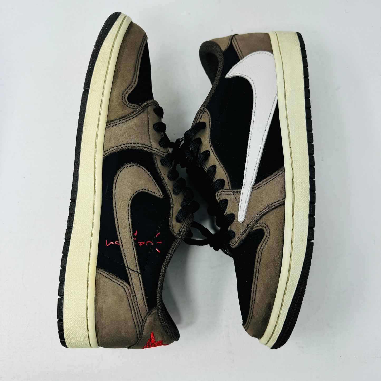 Jordan 1 Retro Low OG SP Travis Scott Mocha sneakers, size 10.5M, 2019 release, worn condition with original box and accessories.