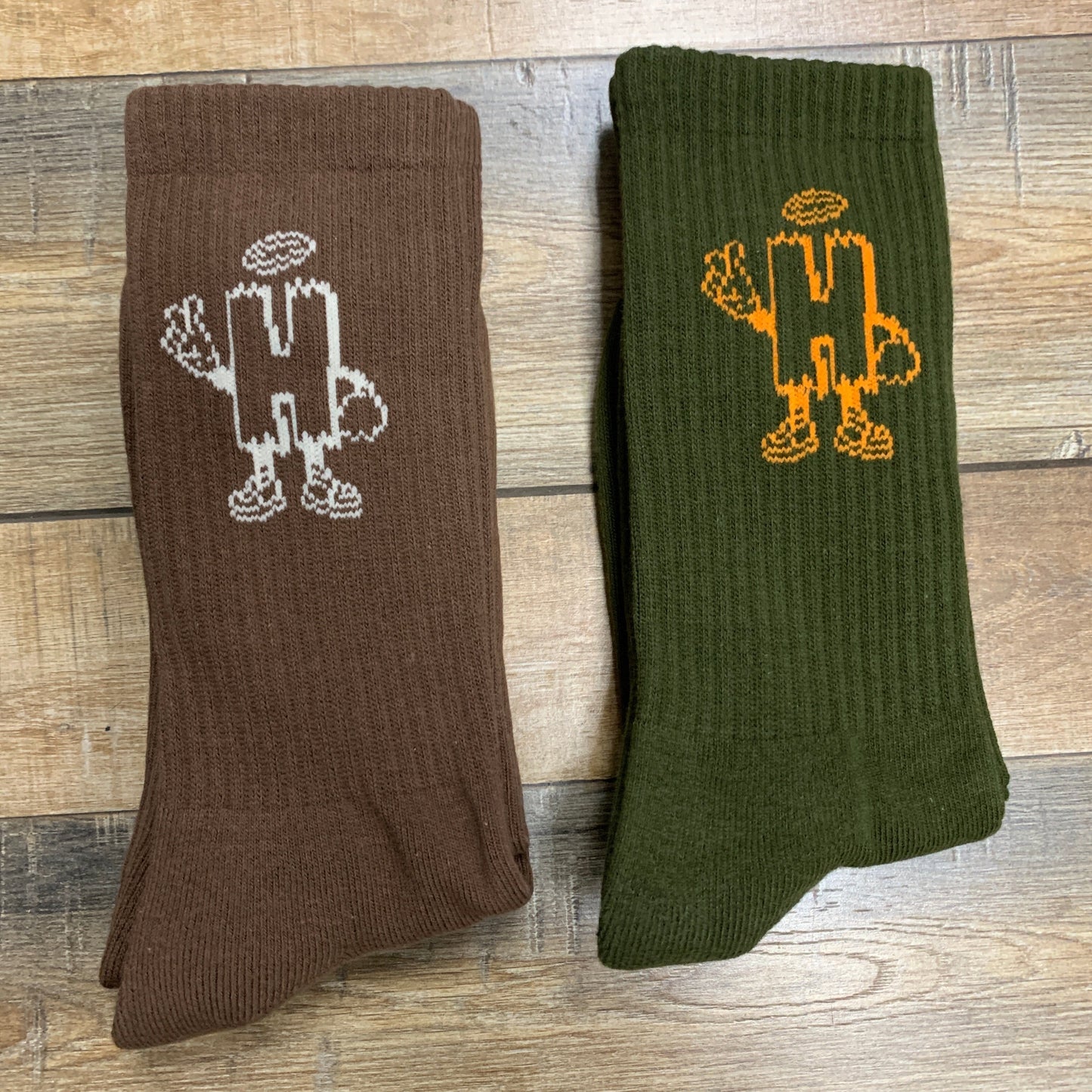 Holy Ground Socks in brown and green with embroidered designs, offering comfort and spiritual connection.