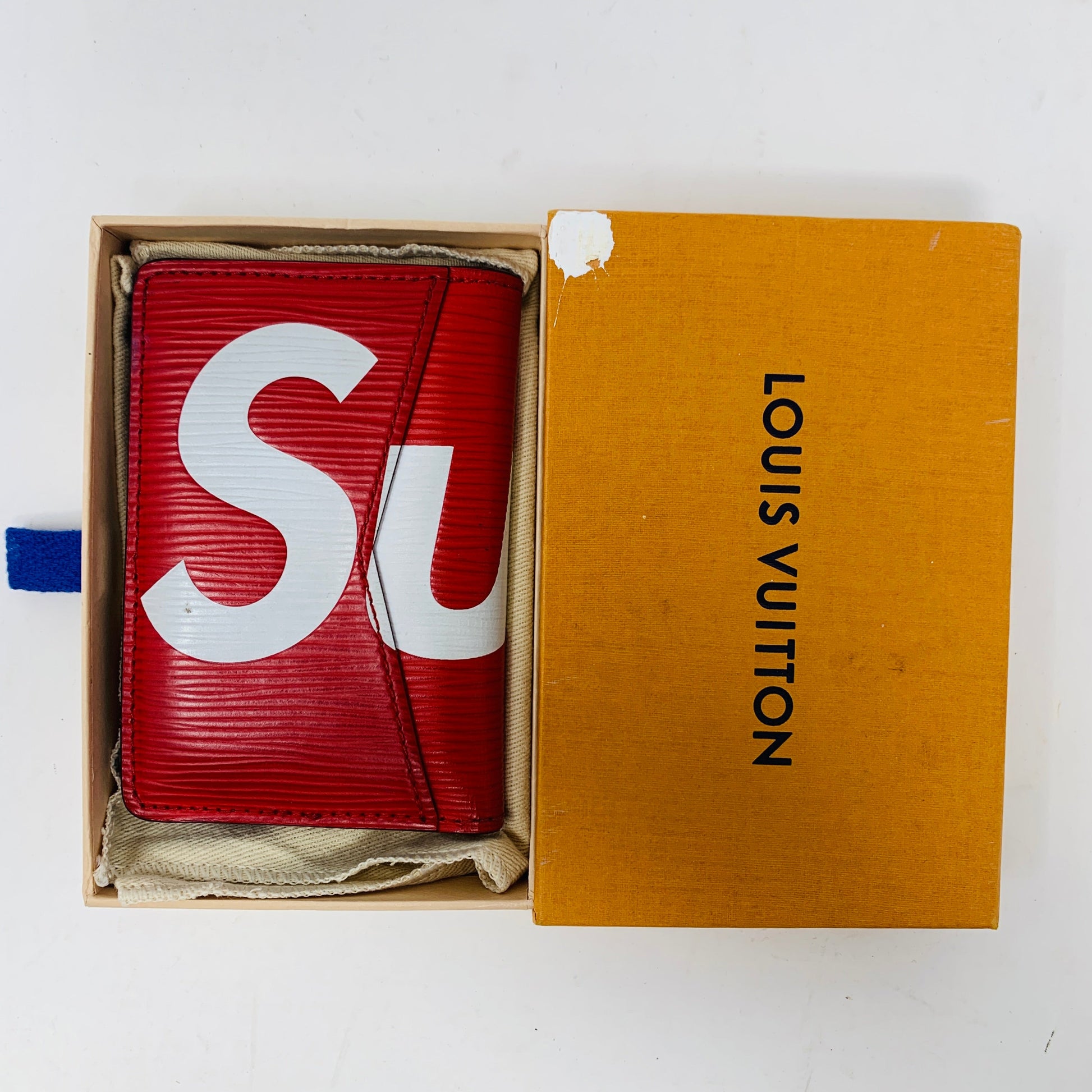 Supreme Pocket Organizer Epi Red in original Louis Vuitton box, preowned condition.