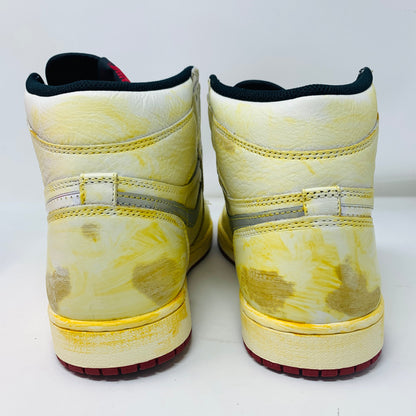 Jordan 1 Nigel Sylvester sneakers with yellow accents and red laces, brand new condition, back view.