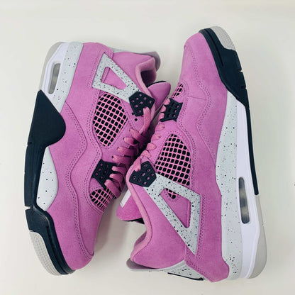 Jordan 4 Retro Orchid Women's sneaker in pink orchid colorway with premium materials.