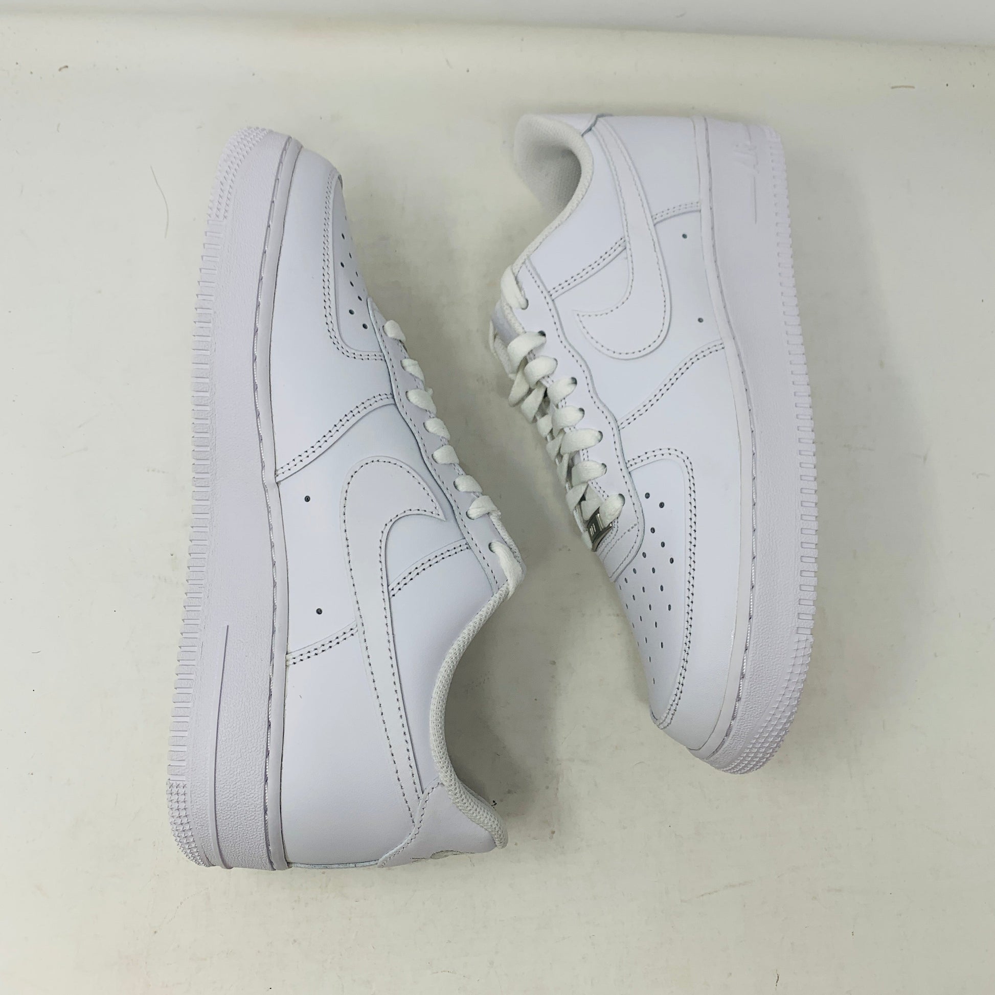 Nike Air Force 1 Low Triple White sneakers, brand new condition, 2023 model.