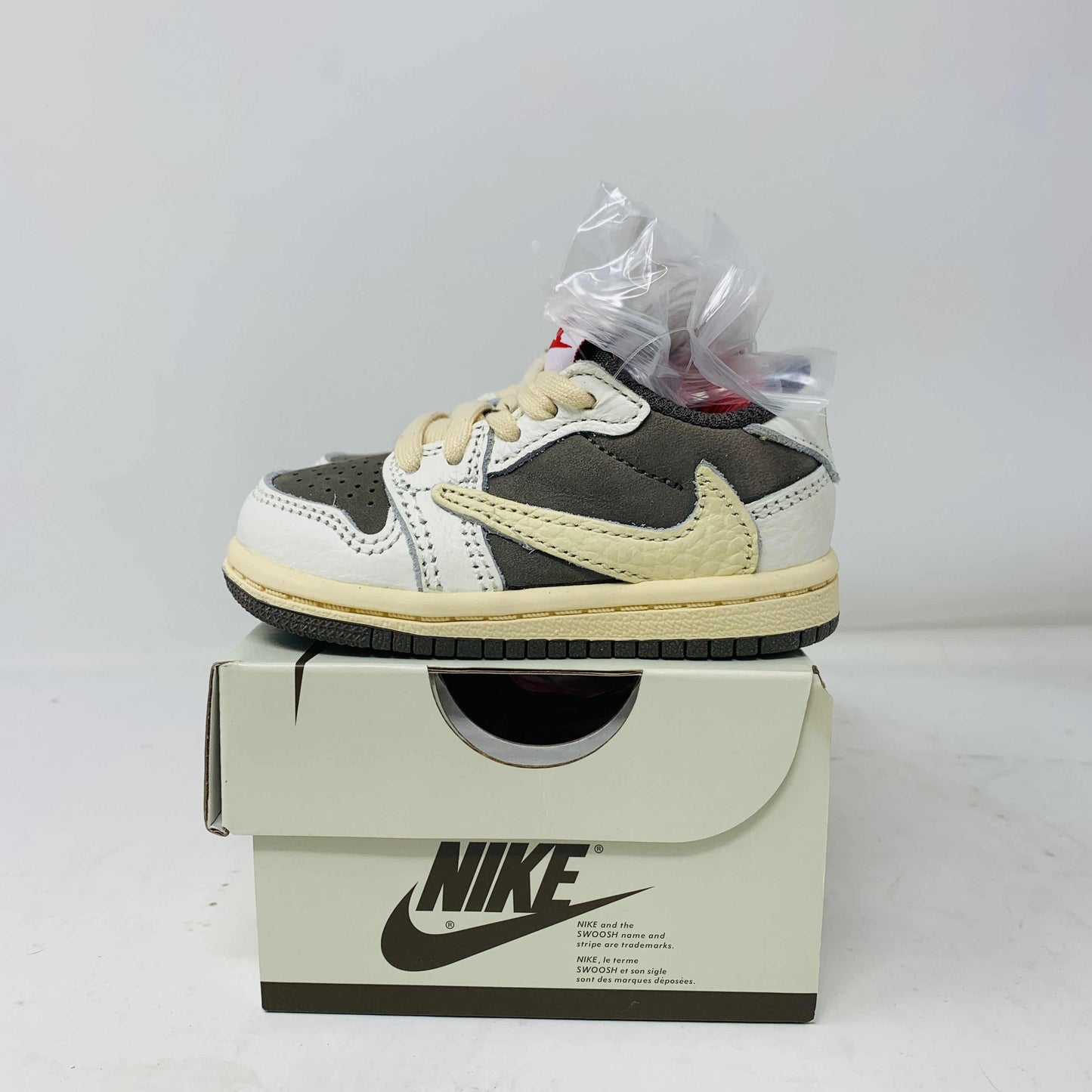 Jordan 1 Low TS Reverse Mocha TD toddler shoes on box, featuring unique reverse mocha colorway and iconic design.