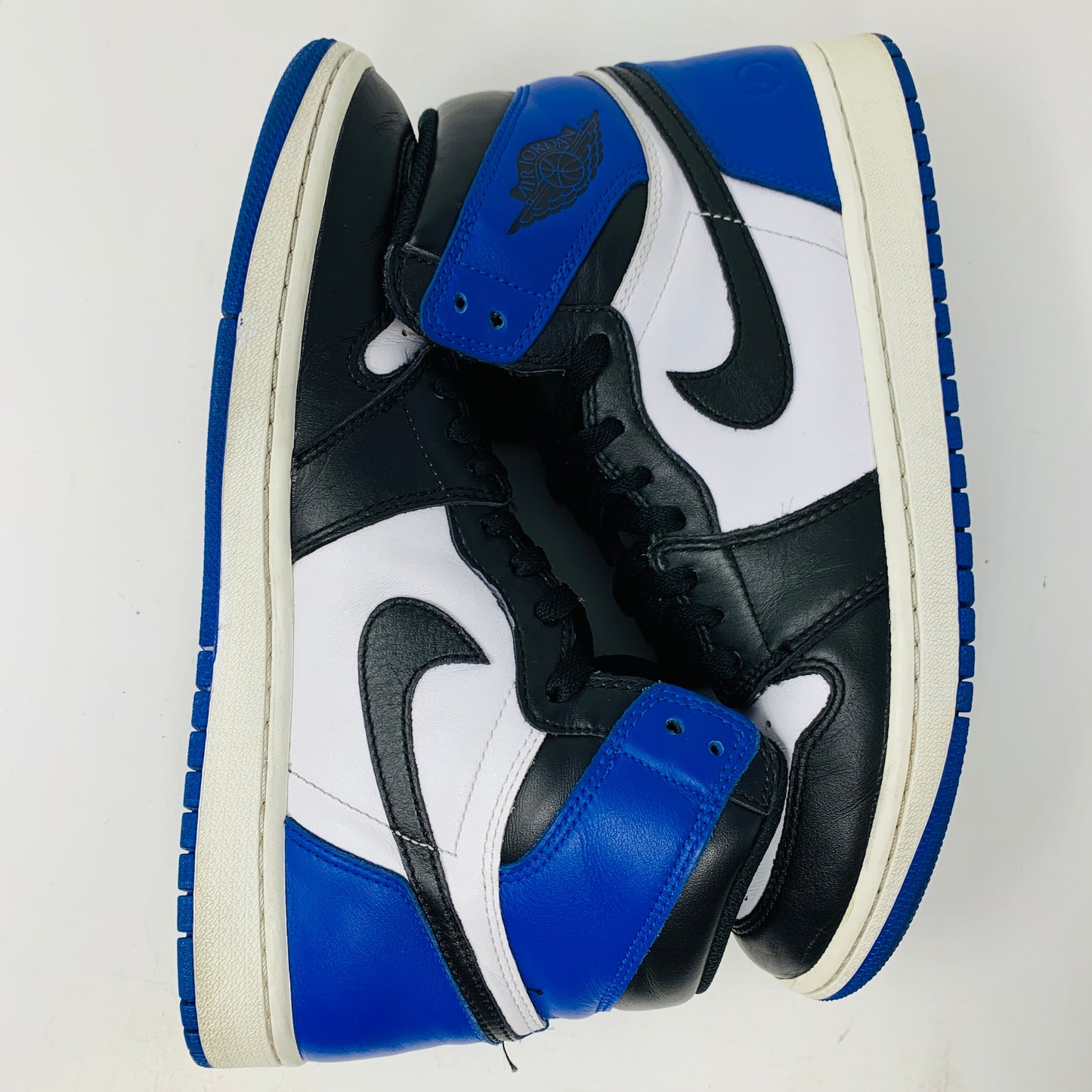 Jordan 1 Retro High Fragment sneakers in black, white, and blue colorway.