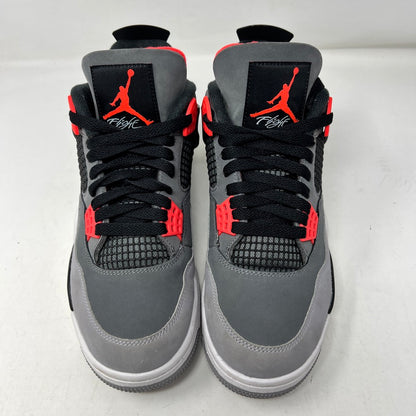 A pair of genuine Jordan 4 Retro Infrared sneakers in gray, black, and infrared is displayed on a speckled shoebox. Released in 2022, they feature a unique side mesh and infrared lace locks. The box labels them as size 9; note there are no returns.