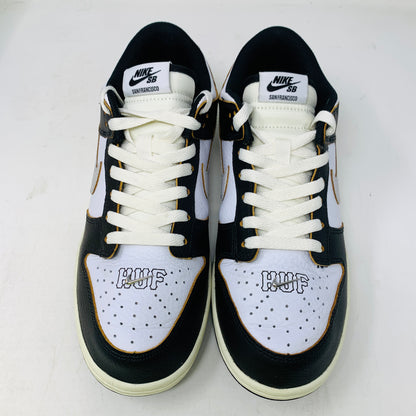 Displayed on a white background, the authentic Nike SB Dunk Low HUF San Francisco sneakers feature HUF embroidered on the toe caps, black and white laces, and have Nike SB San Francisco on the tongue.