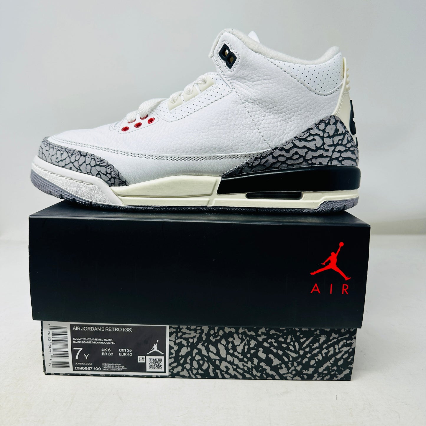 Jordan 3 Retro White Cement Reimagined GS sneakers, size 7Y, displayed on box.