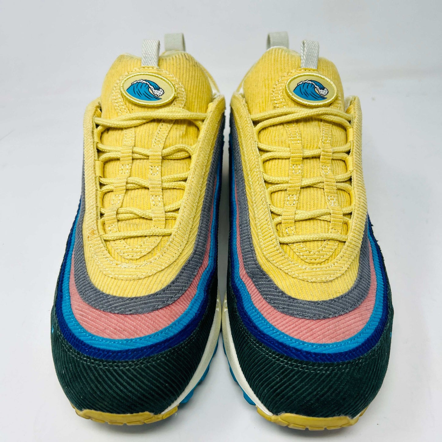 The Nike Air Max 1/97 Sean Wotherspoon boasts an authentic wavy pattern in yellow, blue, green, gray, and pink. Featuring thick laces and an emblem on the tongue, theyre set against a plain white backdrop and include extra laces.