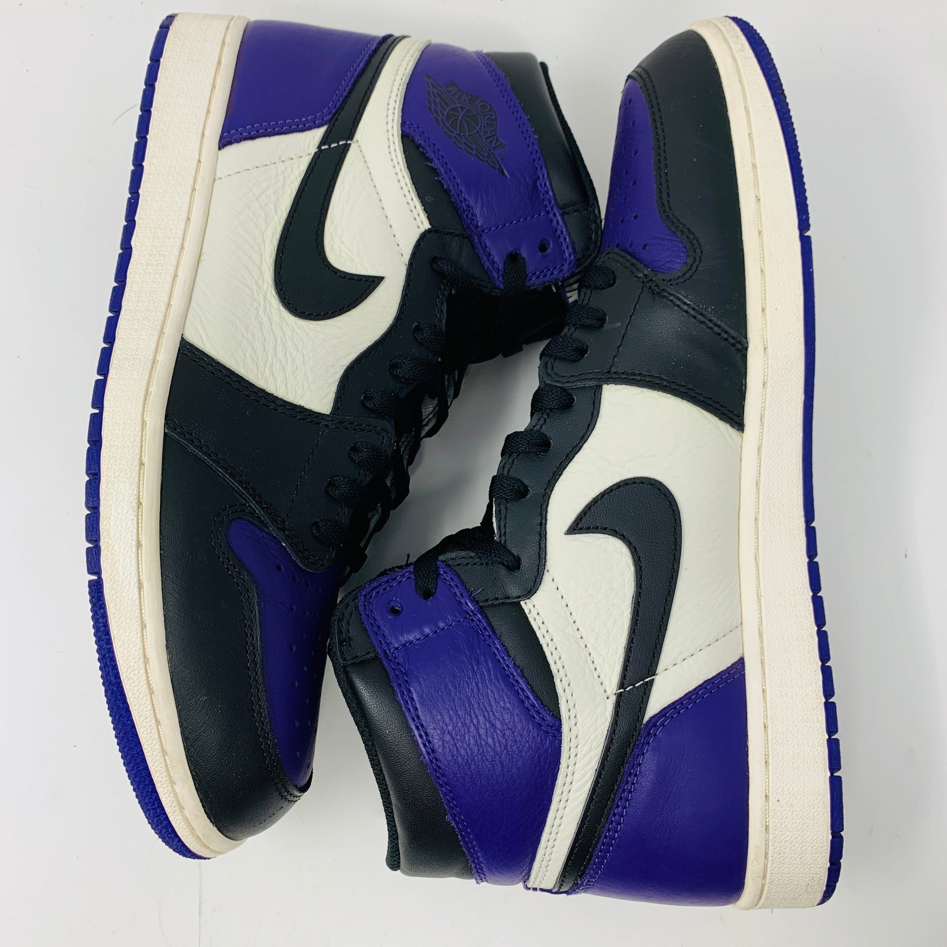 Jordan 1 Retro High Court Purple sneakers size 13 with purple laces, clean uppers, and clean outsoles.