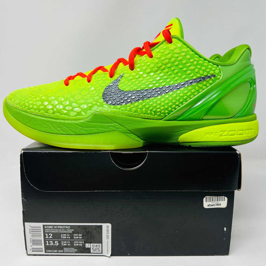 Nike Kobe 6 Protro Grinch 2020 sneaker in good condition with red laces, displayed atop box.