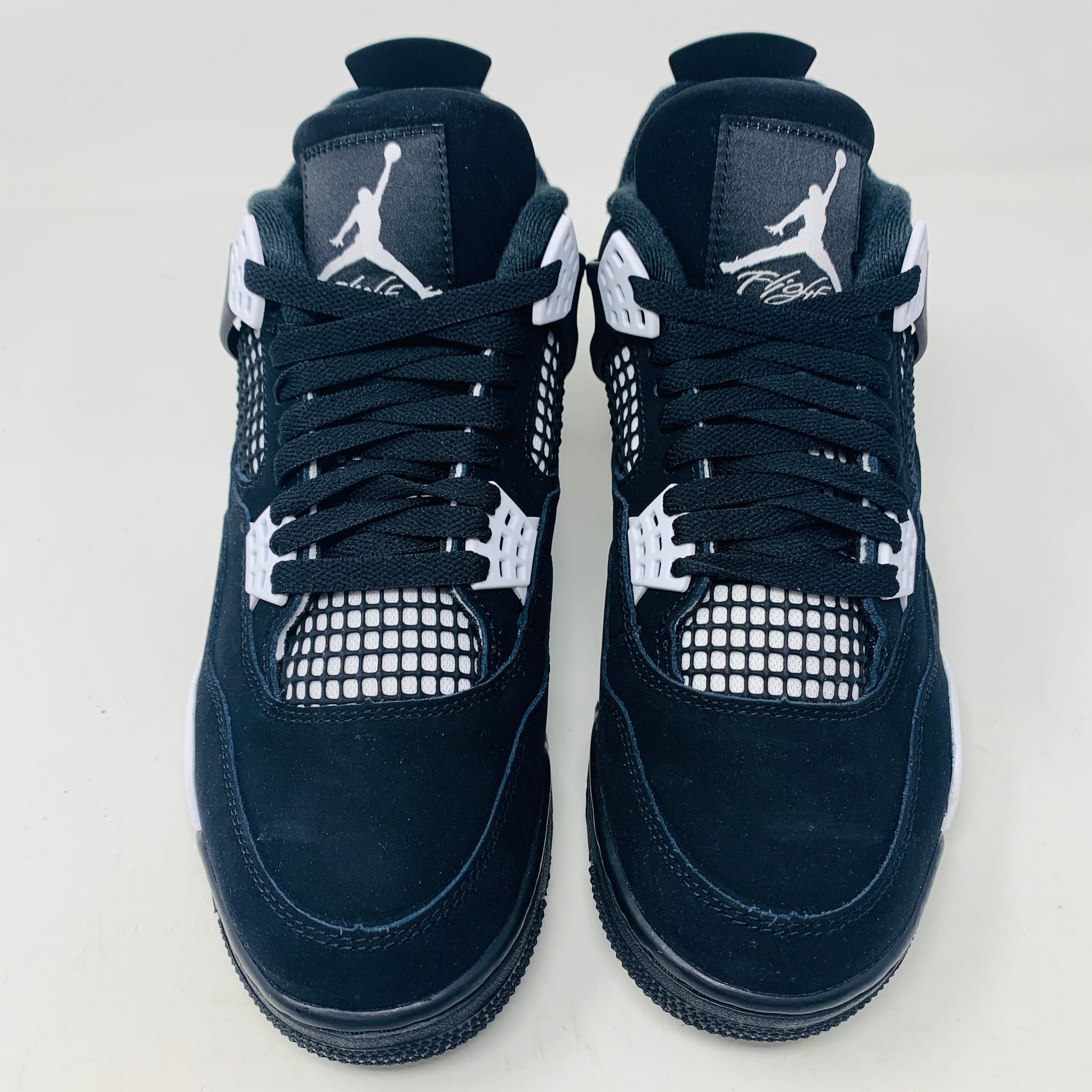 Jordan 4 Retro White Thunder sneakers, brand new, black and white design, 2024 release.